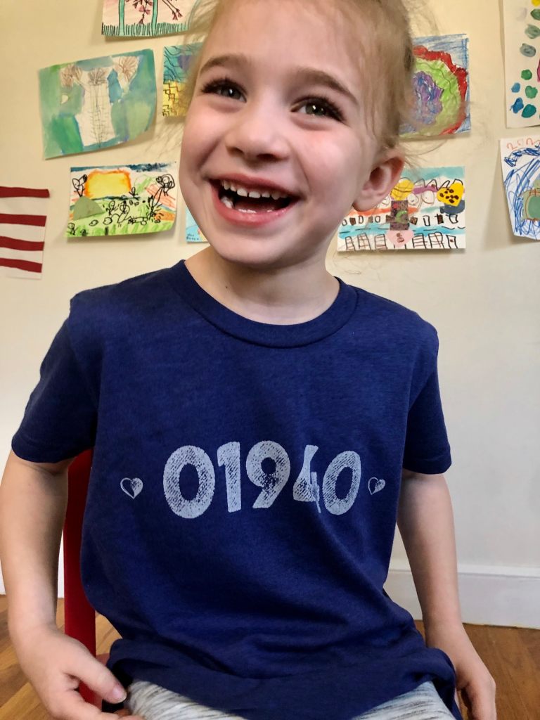 Smiling girl in 01940 tshirt